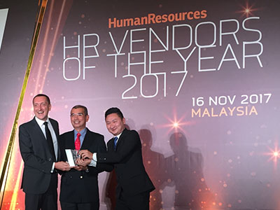 3 men showing their price during HR Vendors of the Year Evening