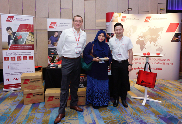 AGS employees at a stand in Malaysia