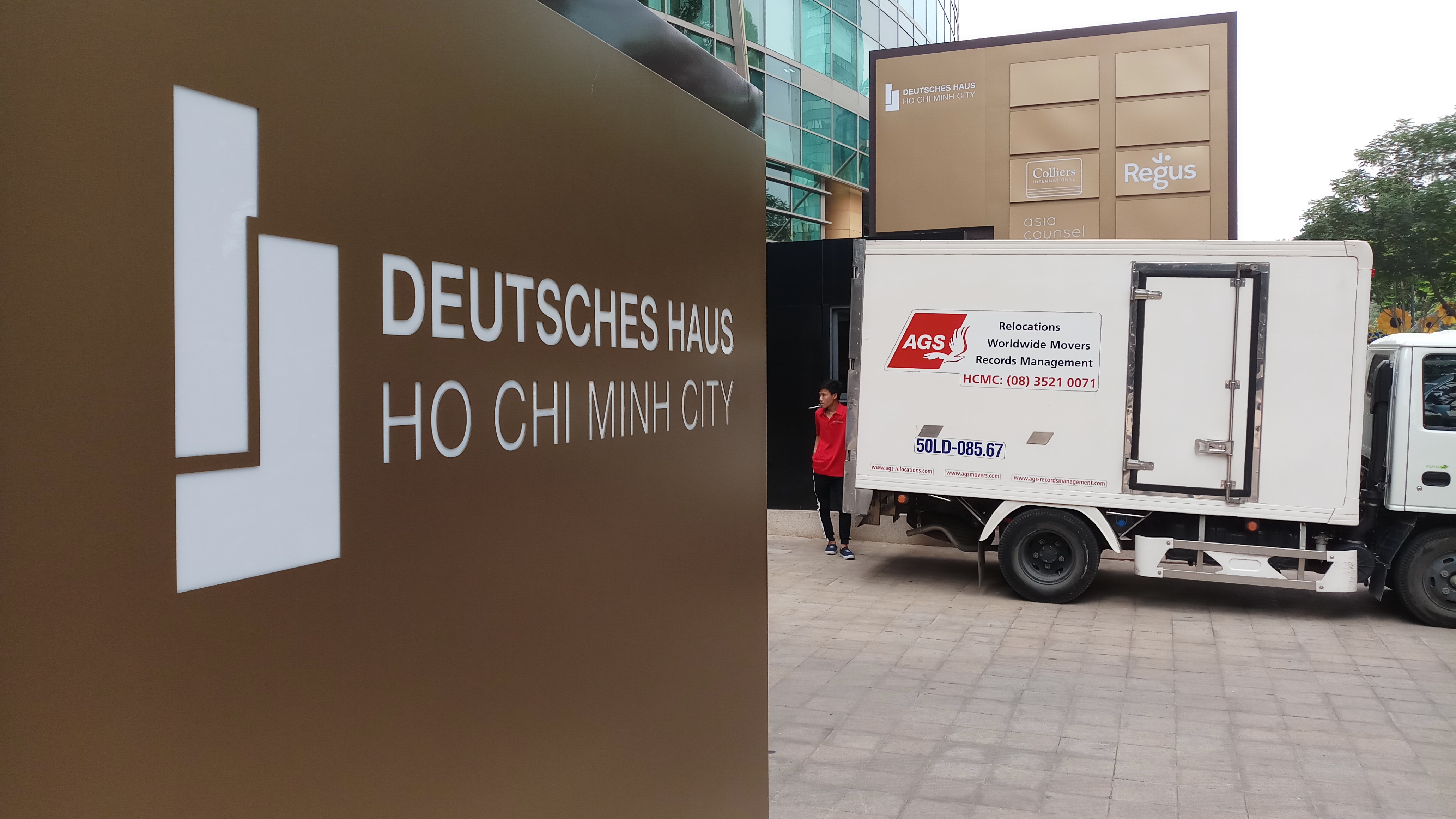 German consulate entrance and AGS Movers trailer.