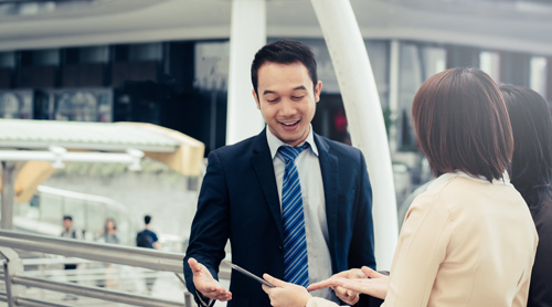 Employees in discussion in the office