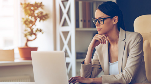 Women busy working on her laptop