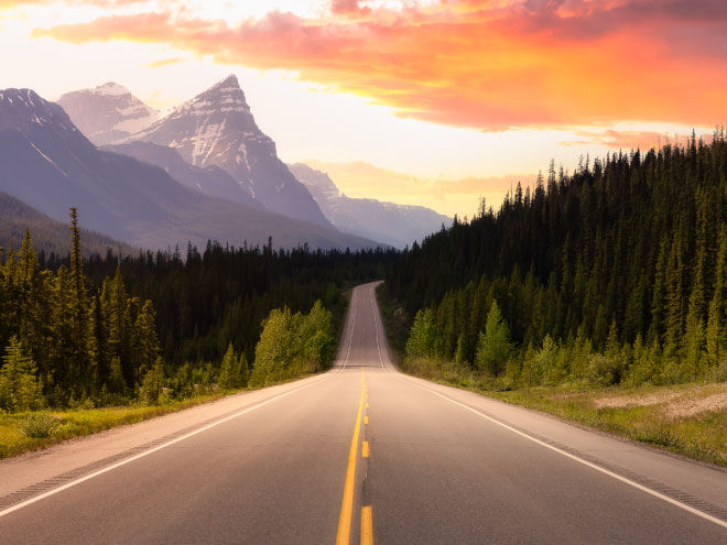 Colorful sunset while driving in Canadian Rockies